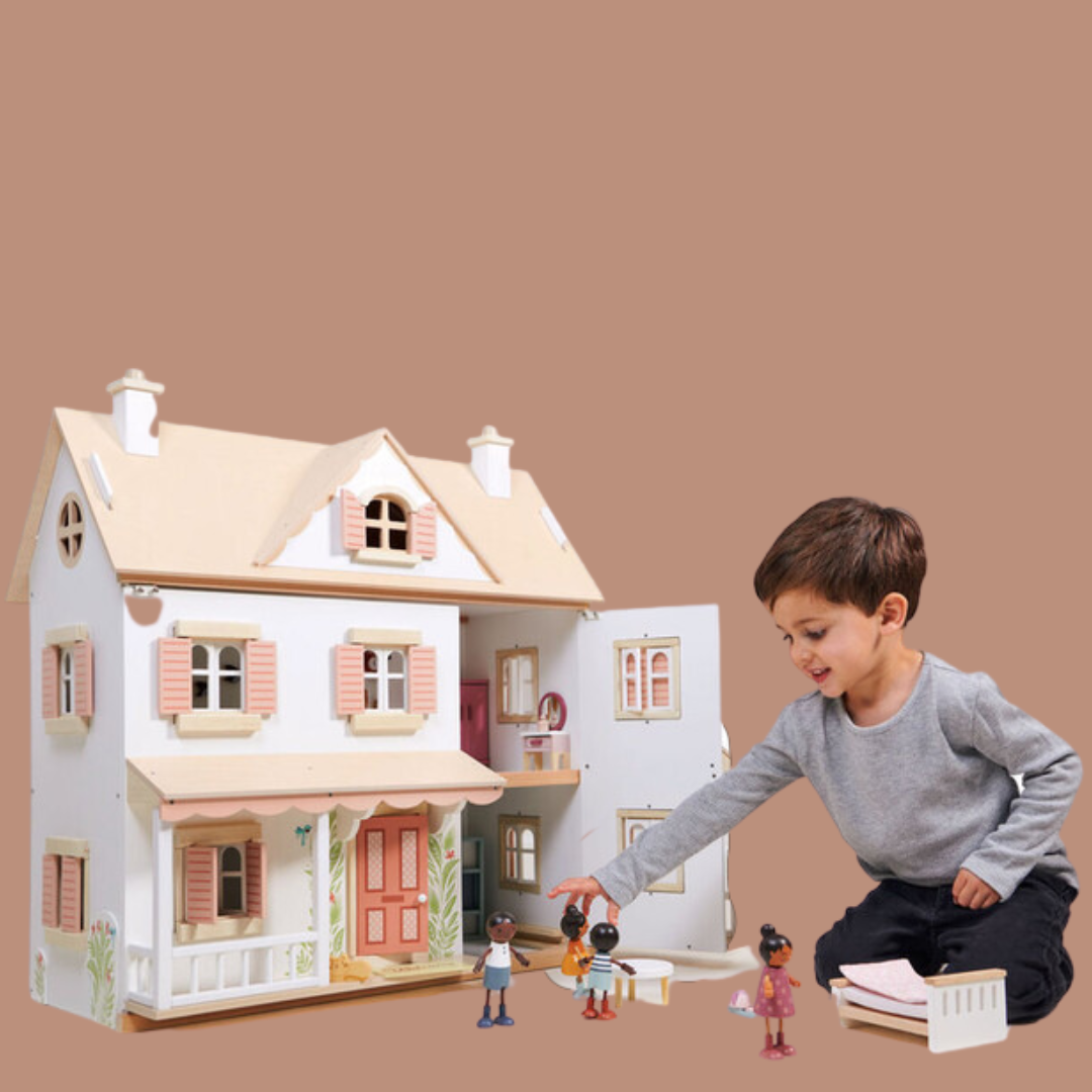 Child playing with large wooden dollhouse and accessories - Doll House Collection at Send A Toy