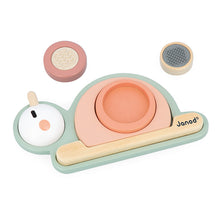 A wooden stacking sensory snail toy with a green base and multiple stacking blocks in beige, pink, and blue, as well as a wooden snail figure.