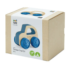 Packaging box of the Timber Trail EV wooden toy car with visible blue wheels and natural wood color body, bearing the Plan Toys logo.