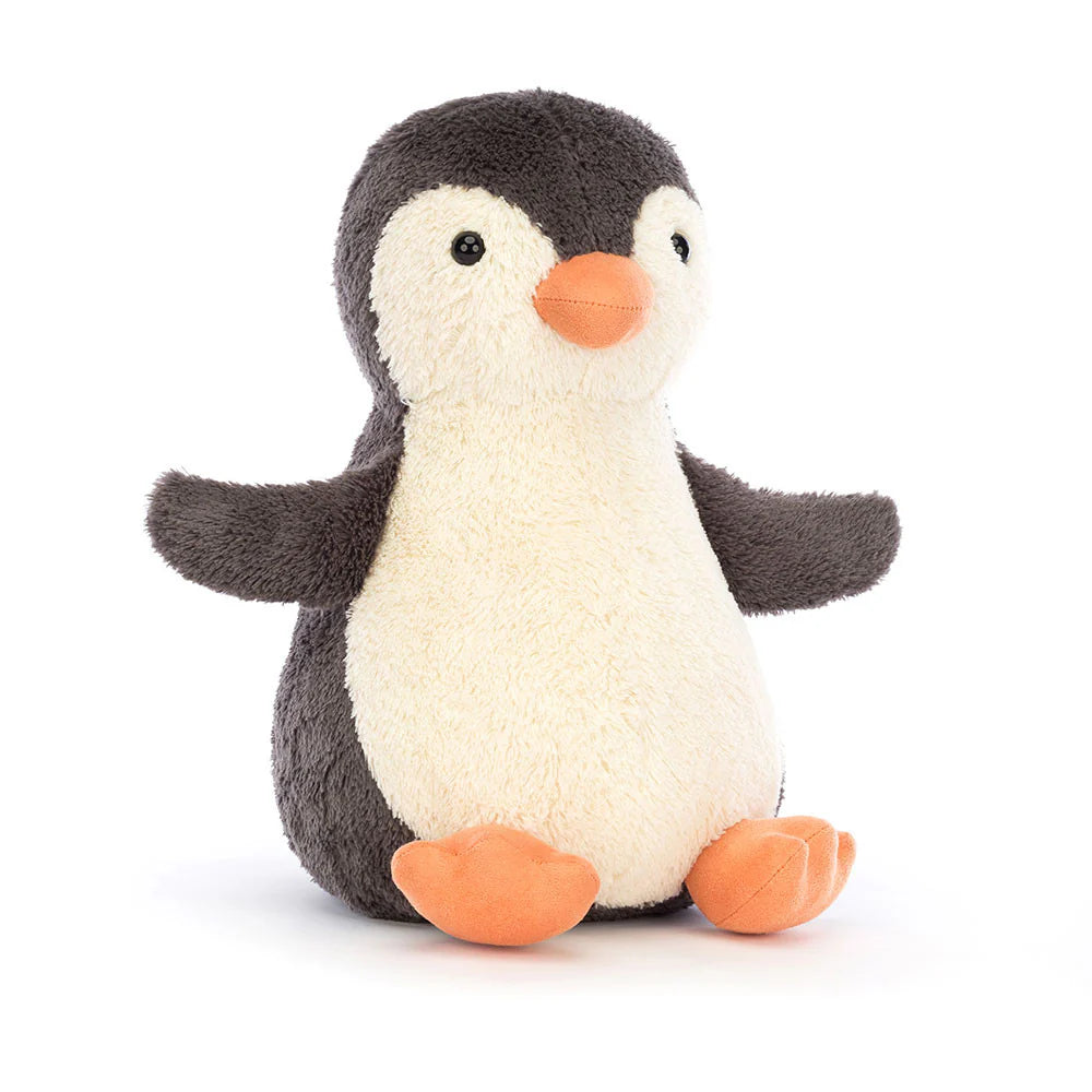 A plush toy penguin with a friendly face, made of soft, baby-like fur, in a white and grey color scheme.