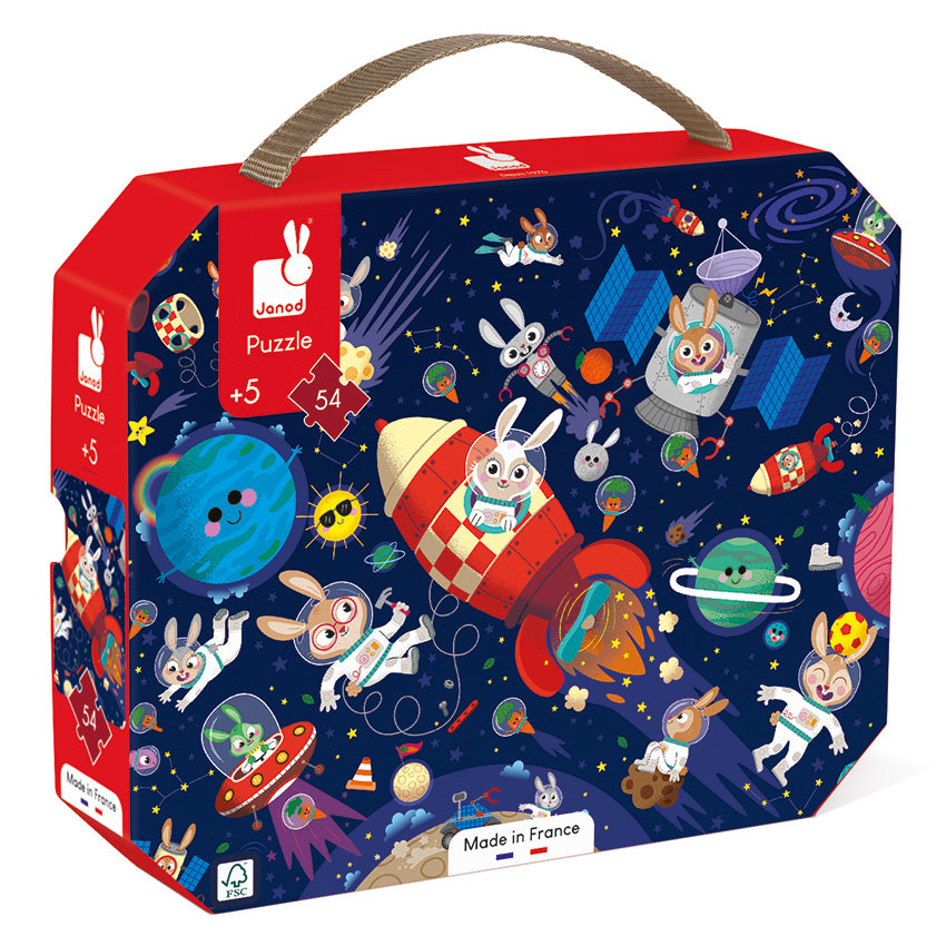 A colorful cardboard puzzle box with a space theme, featuring illustrations of rabbits, rockets, and planets. The box is marked with '54 pieces' and 'Made in France'.