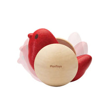 Red and natural bird-shaped wooden toy with 'PlanToys' branding on a white background