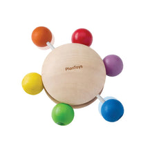 Colorful wooden baby toy with 'PlanToys' branding on a white background