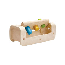Wooden toy with colorful knobs on a white background