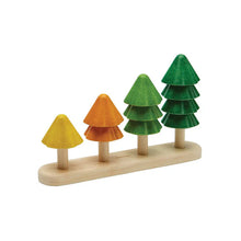 Set of colorful wooden trees on a white background