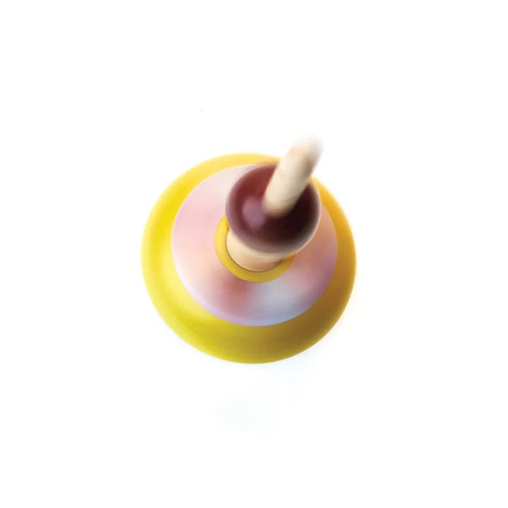 Colorful wooden spinning top on a white background