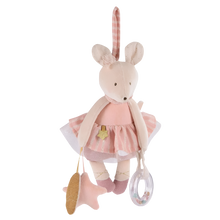 A hanging activity toy in the shape of a mouse wearing a pink dress with a tutu and holding a ring rattle, with a dinging star, rustling leaf, and a hidden mirror.