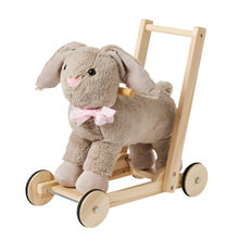 A plush gray bunny walker with a wooden frame and wheels, featuring easy grip handles.