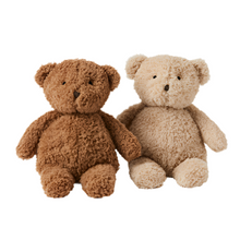 Two teddy bears, one brown and one beige, on a white background