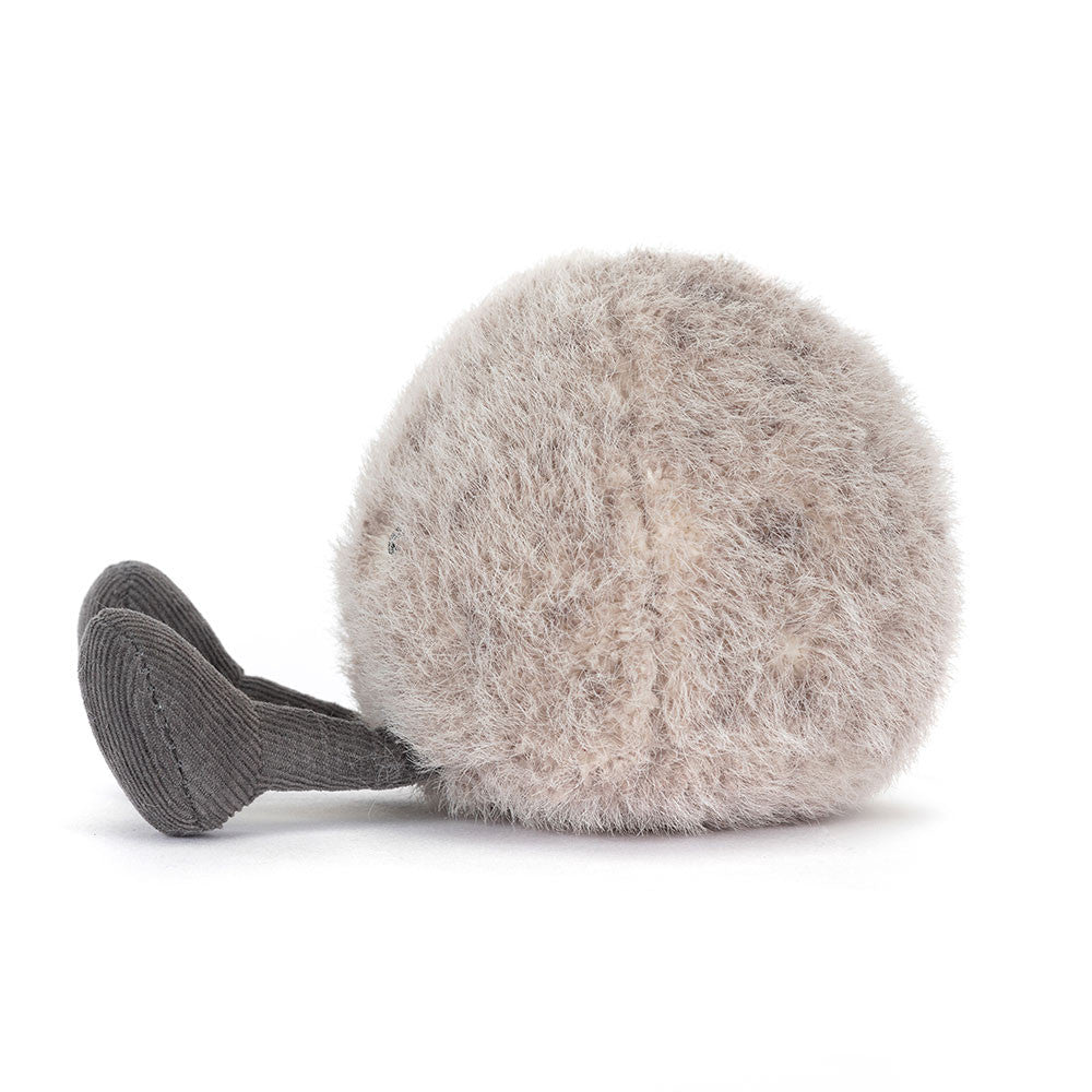 Plush toy resembling a round grey pebble with legs on a white background
