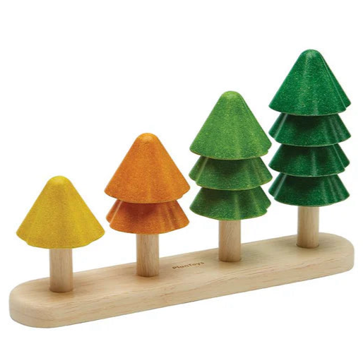 Set of wooden toy trees on a base with different colored tops