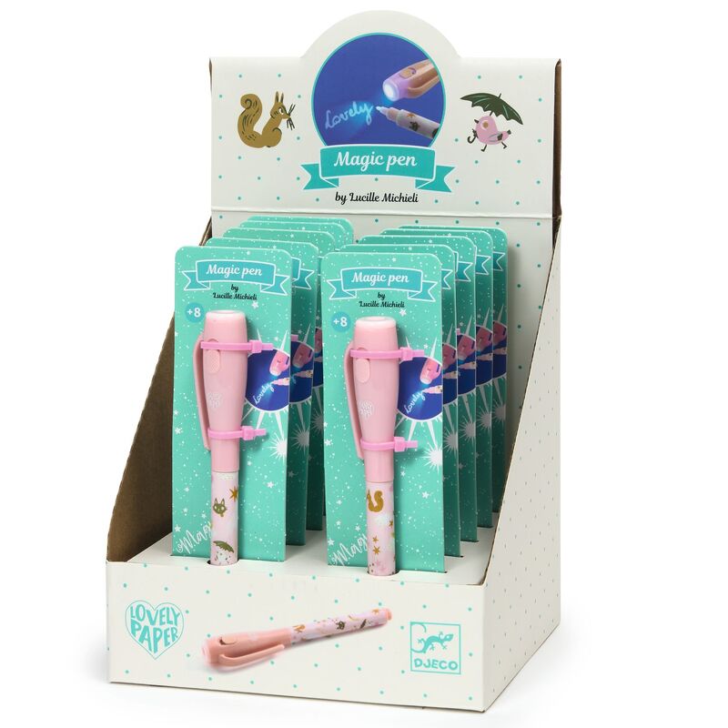 A packaged 'Lucille Magic Pen' with a pink and white design, visible through a window in its packaging. The box is adorned with playful illustrations and the text 'Love to draw? Let's draw together!'.
