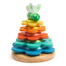 A colorful wooden stacking toy with flower-shaped rings in shades of yellow, orange, green, blue, and purple, topped with a green butterfly.