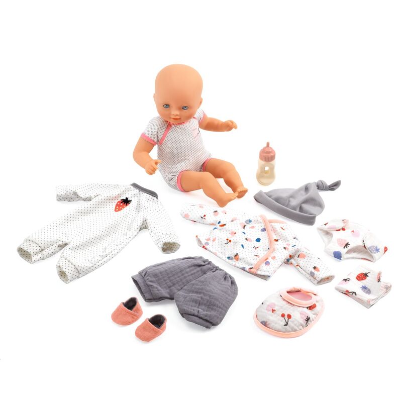 Baby doll with clothing and accessories on a white background