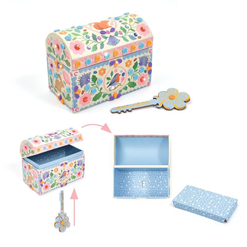 Decorative jewelry box with floral pattern, key, and open lid on a white background