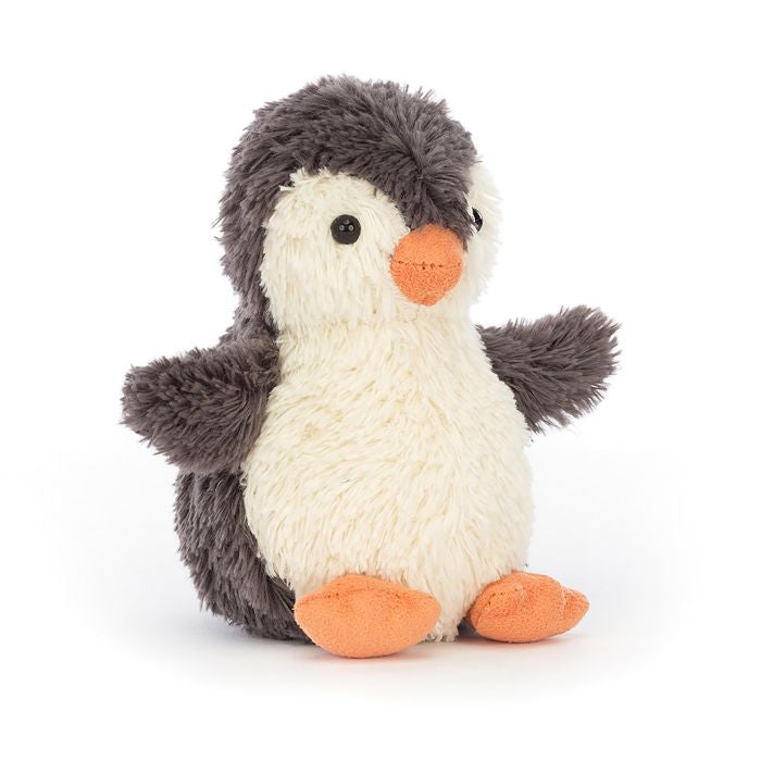 A soft plush toy resembling a peanut-shaped penguin with a friendly face and fuzzy flippers in a beige and gray color scheme.