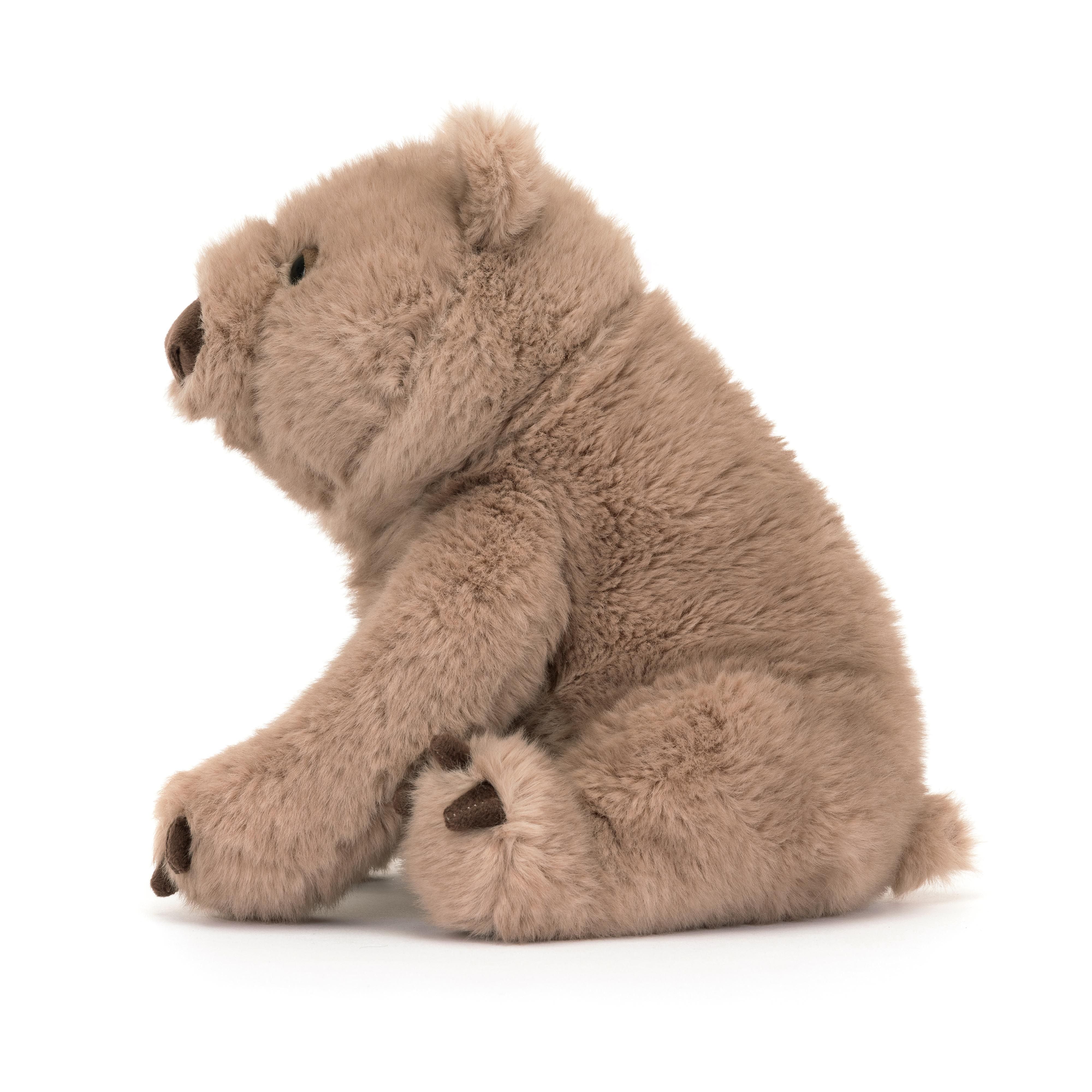 Brown wombat soft toy with dark brown nose and claws
