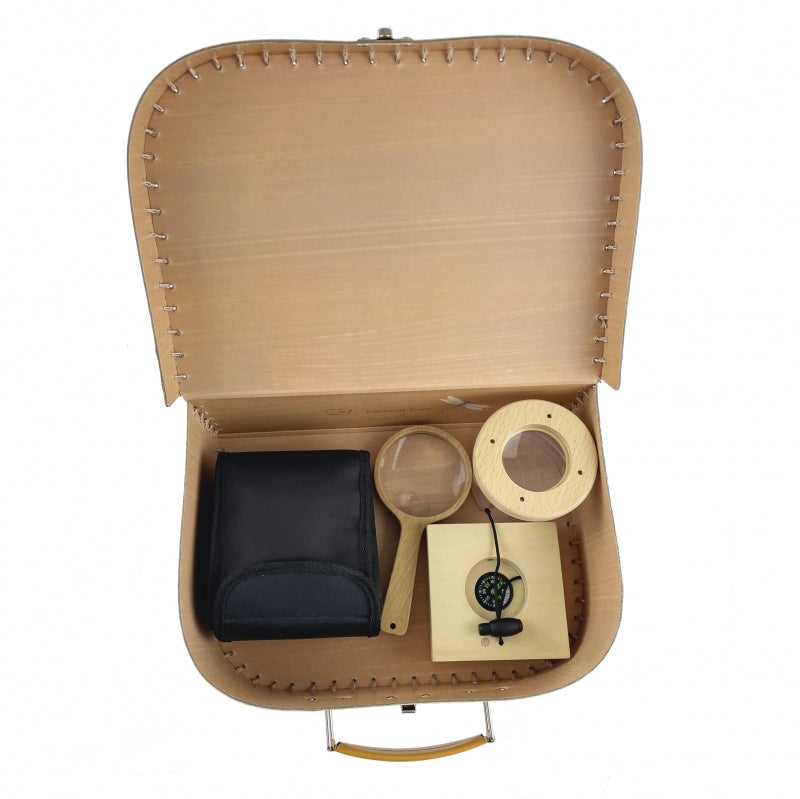 Open tan cardboard case with black pouch, magnifying glass, and wooden item on a white background