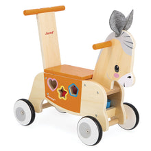 Wooden toy donkey with wheels and colorful shapes on a white background