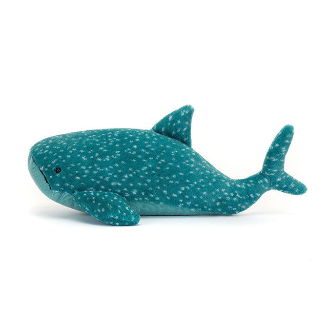 Teal plush whale toy with white spots on a white background