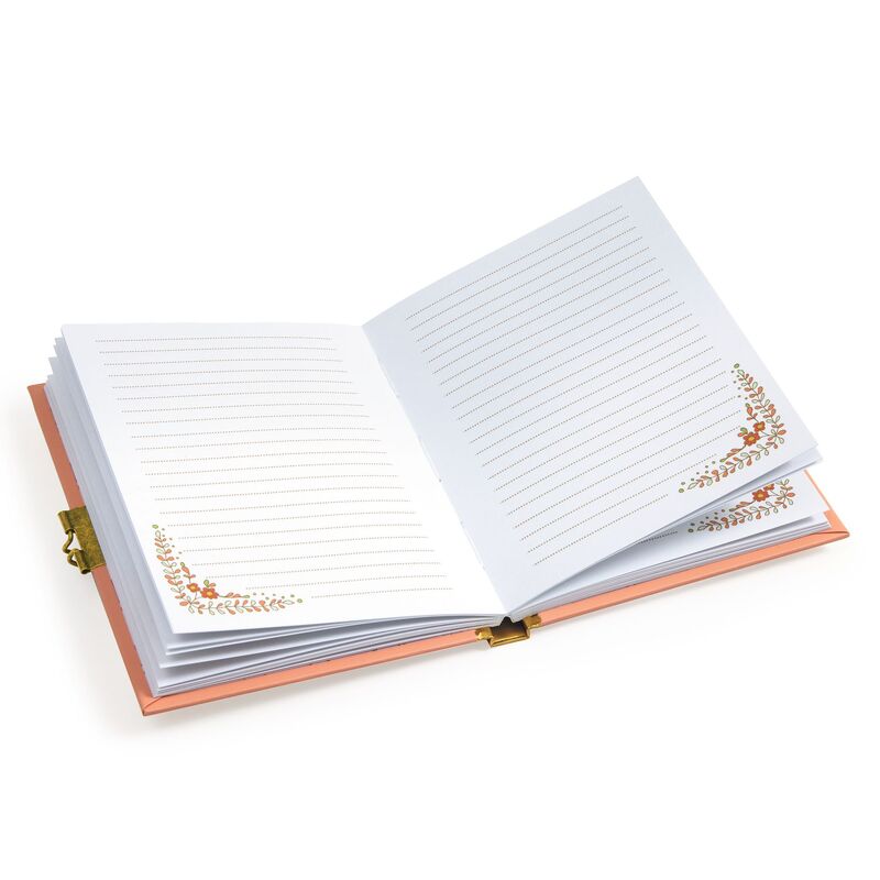 Open notebook with decorative floral corners on a white background