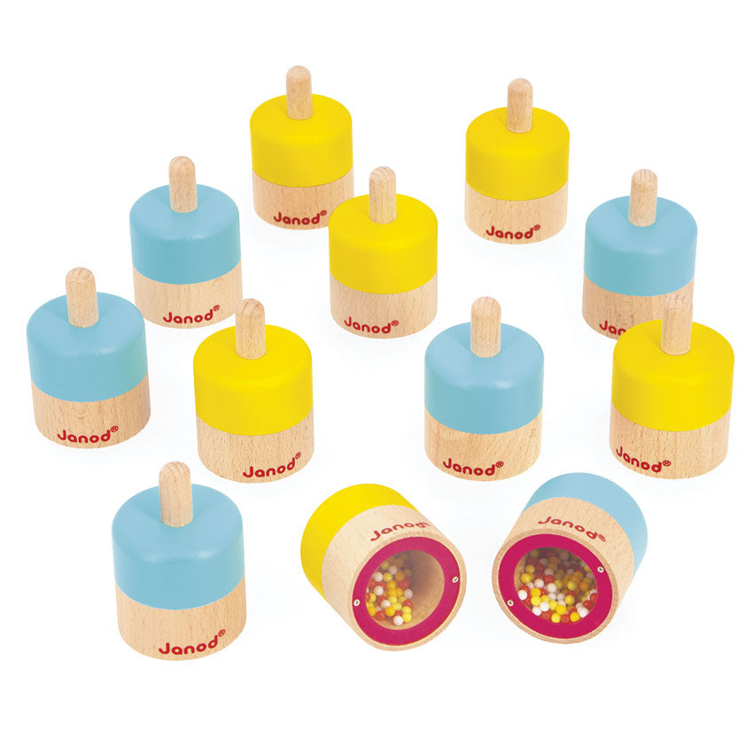 Set of wooden sensory sound toys with colorful tops and visible brand 'Janod' on a white background.