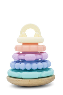 A pastel-colored stacking toy with a natural beech wood base designed for babies.