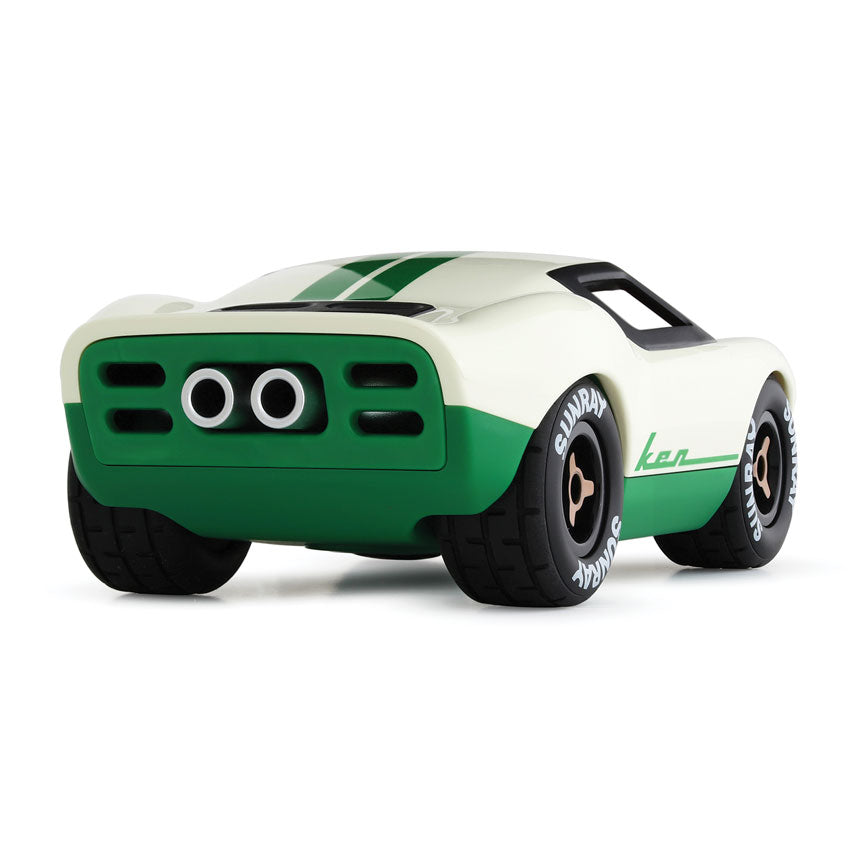 Toy car with green and white design on a white background