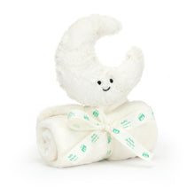A plush toy in the shape of a crescent moon with a smiling face, textured cream fur, and an embroidered eye and smile. It is rolled up with a Baby Jellycat grosgrain ribbon.