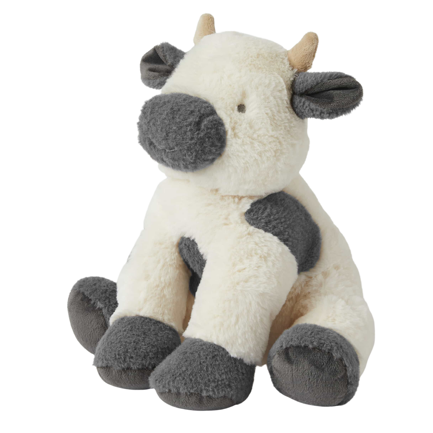 Grey and cream cow plush toy on a white background