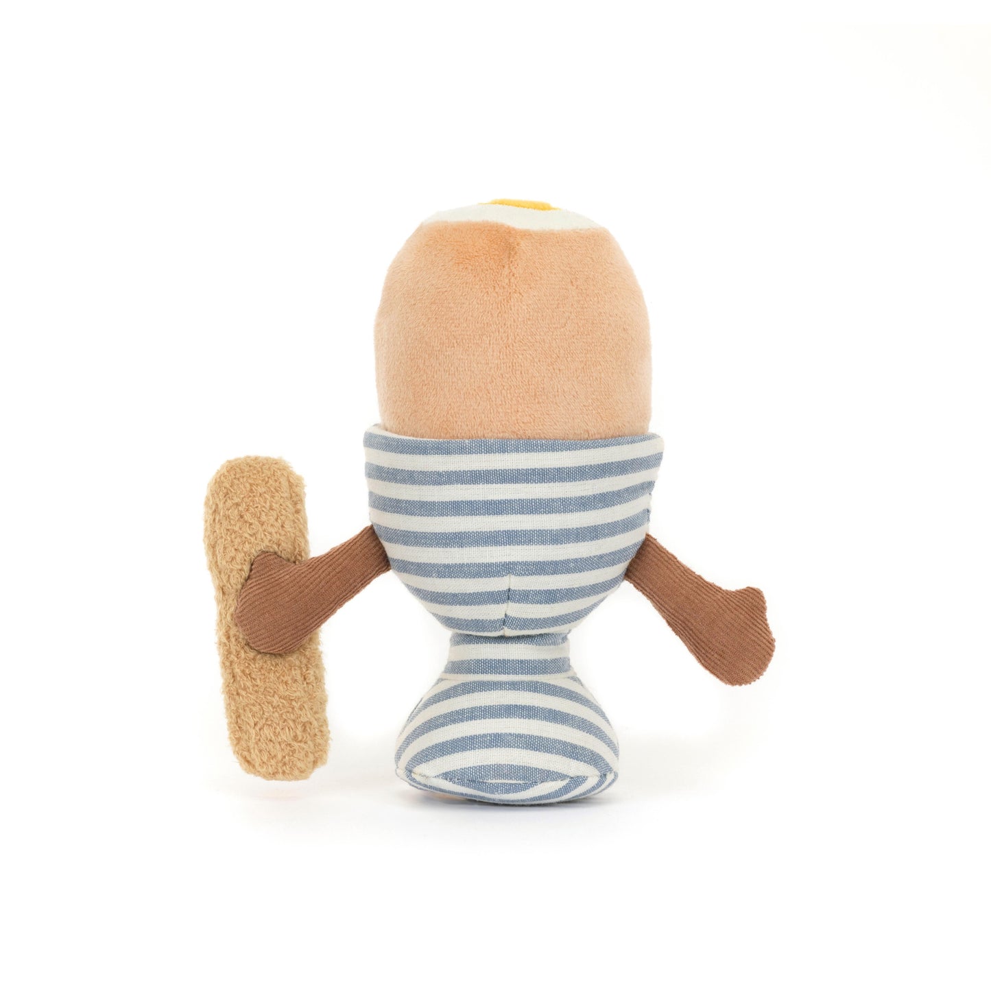 A soft toy resembling a dippy egg in a blue and white stripe egg cup with a brown toast soldier.