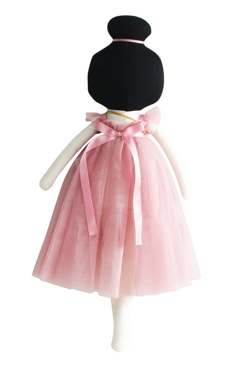Black and white doll with a pink tulle skirt on a white background