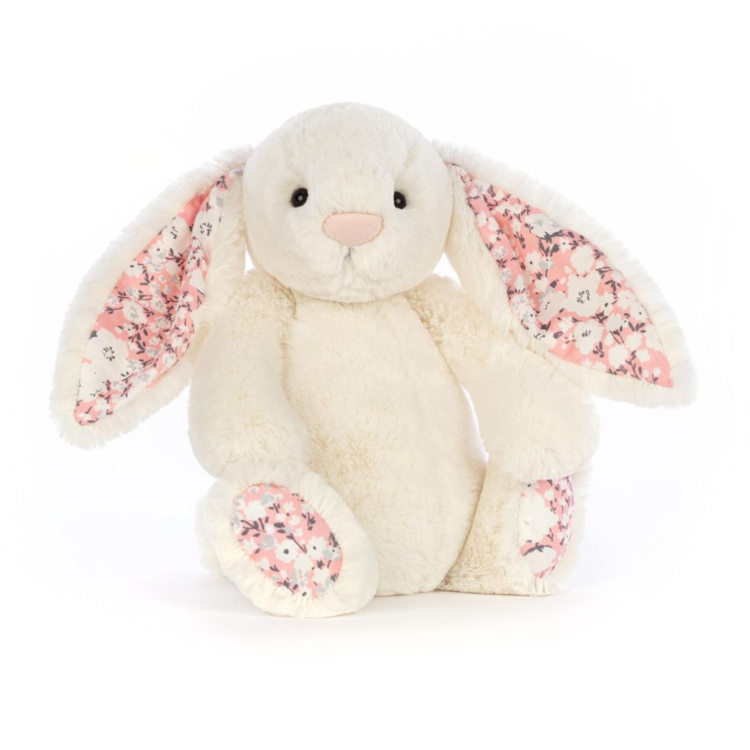 Cream Jellycat bunny stuffed toy with cherry blossom fabric accents on ears and feet