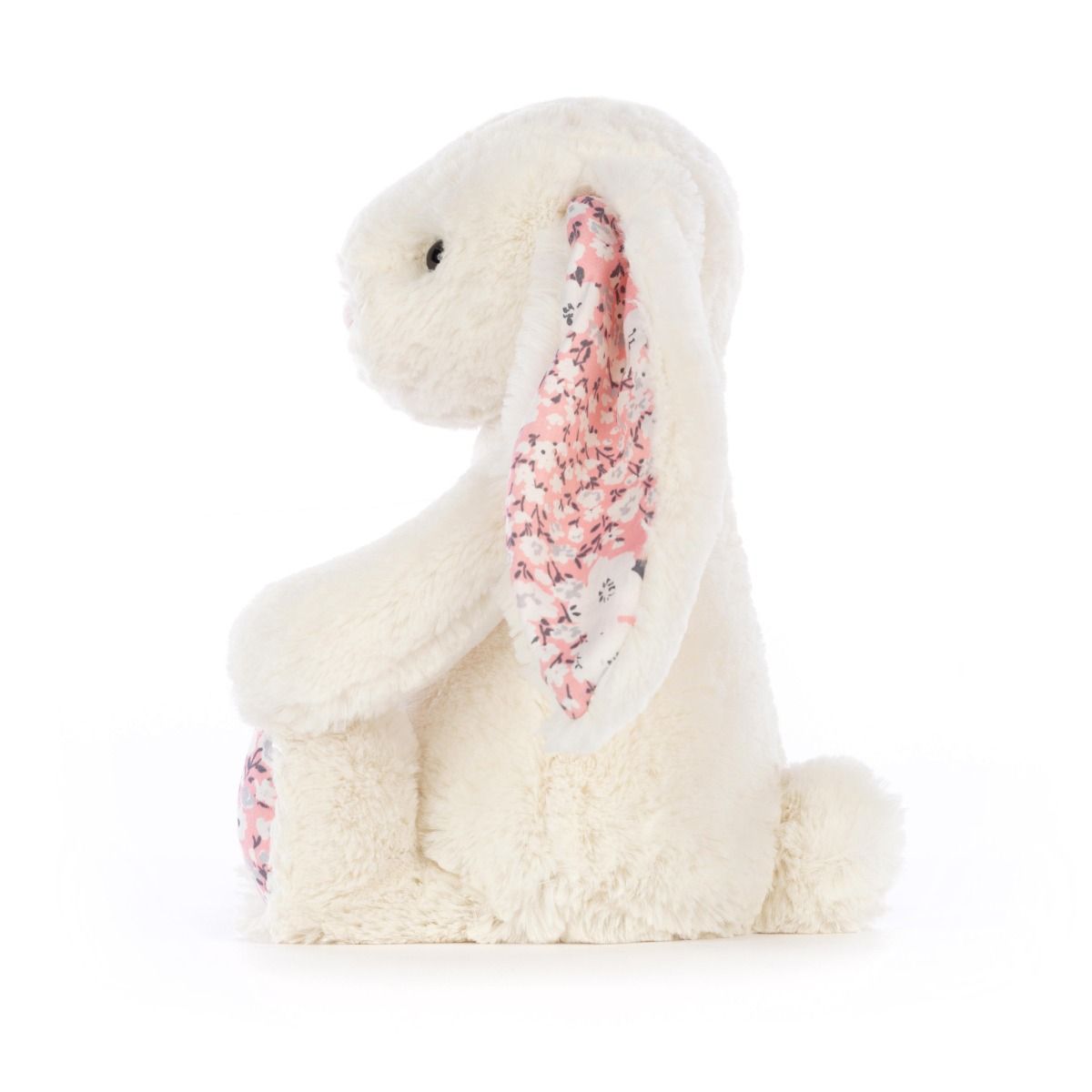 Cream Jellycat bunny stuffed toy with cherry blossom fabric accents on ears and feet