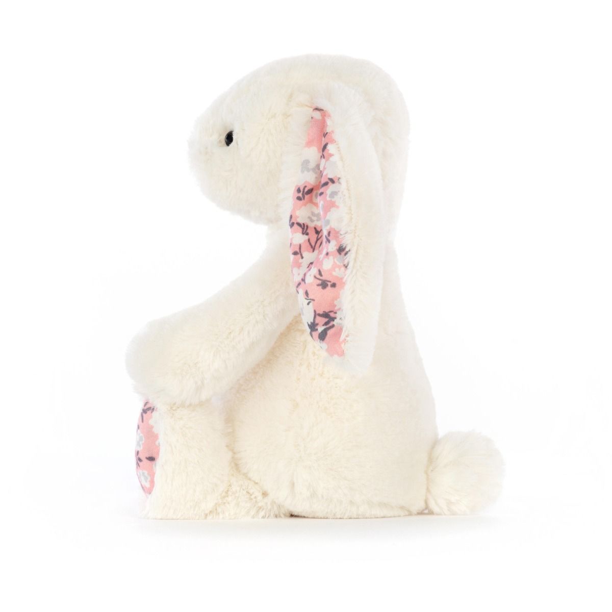 Cream Jellycat bunny stuffed toy with cherry blossom fabric accents on ears and feet