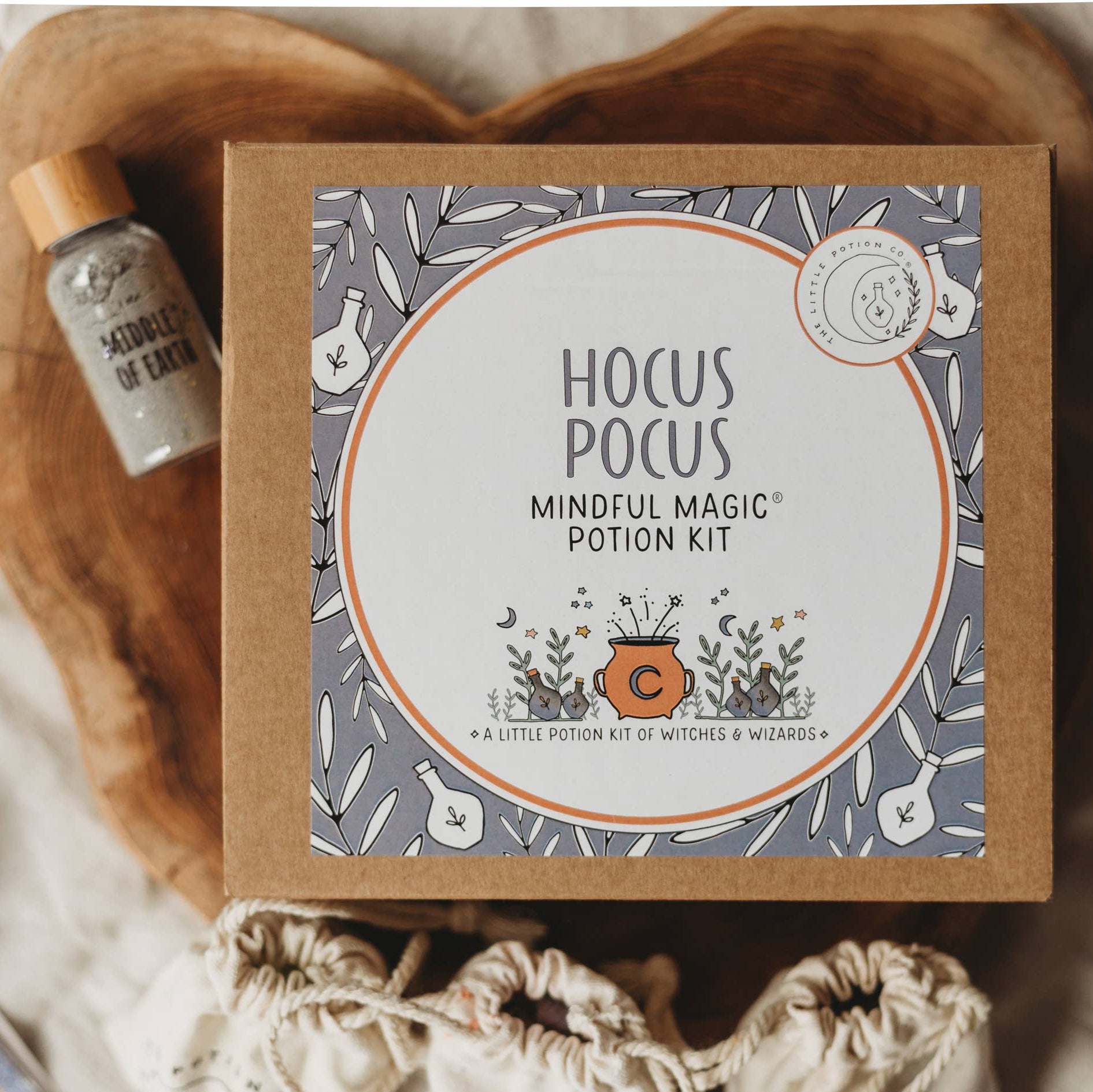 Hocus Pocus Mindful Magic Potion Kit on a wooden surface with a small bottle.