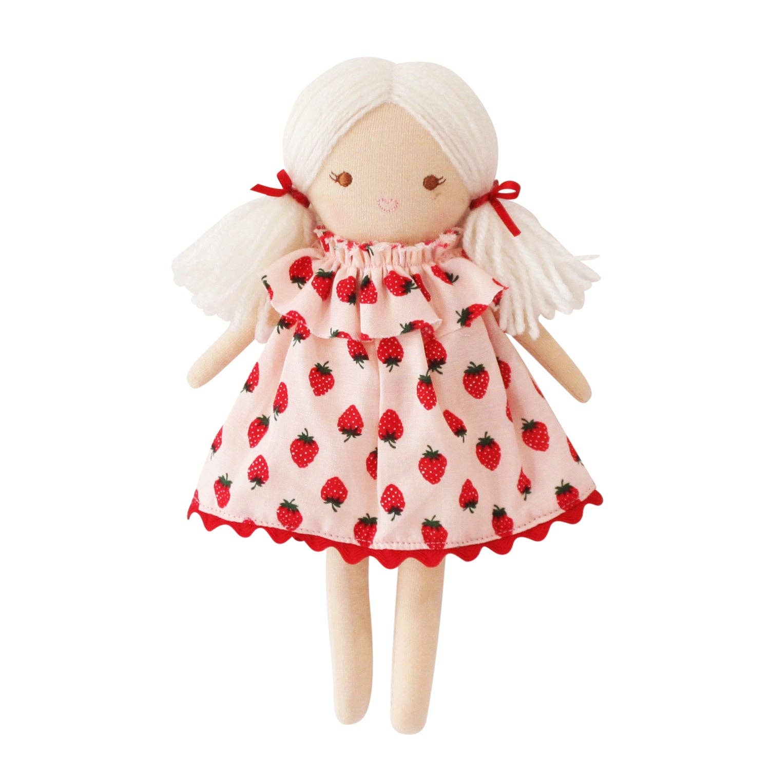 Toy doll with strawberry-patterned dress on a white background