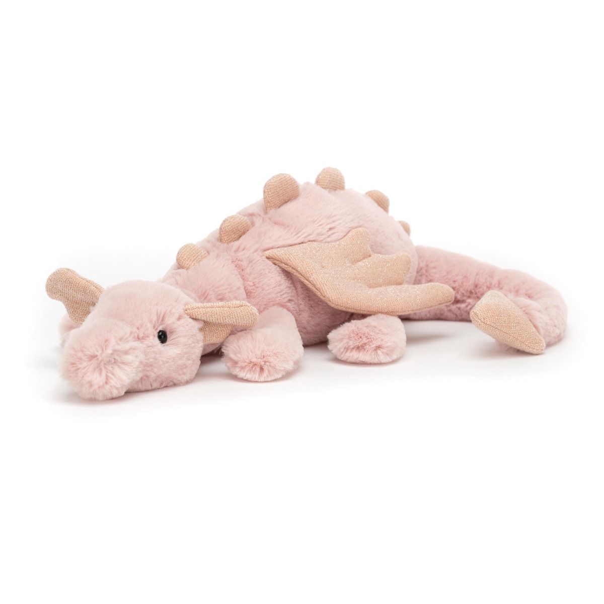 A plush toy resembling a pink dragon with soft texture, lying on a plain background.