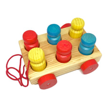 A wooden Omnibus Pull-Along toy with colorful people-shaped pegs and a red pull-string on a white background.