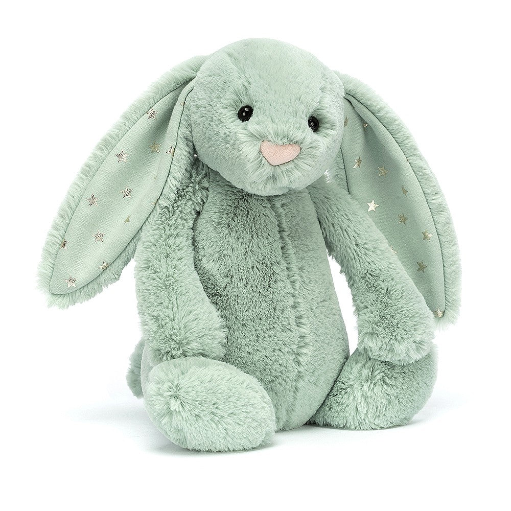 A medium-sized green plush toy rabbit with stars on its ears.