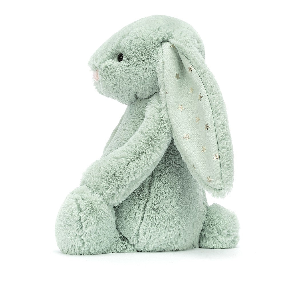 A medium-sized green plush toy rabbit with stars on its ears.