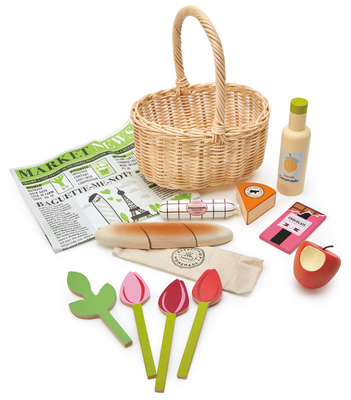 Child's wicker shopping basket with wooden apple, flowers, cheese, salami, chocolate, lemonade and bread - Tender Leaf Toys at Send A Toy