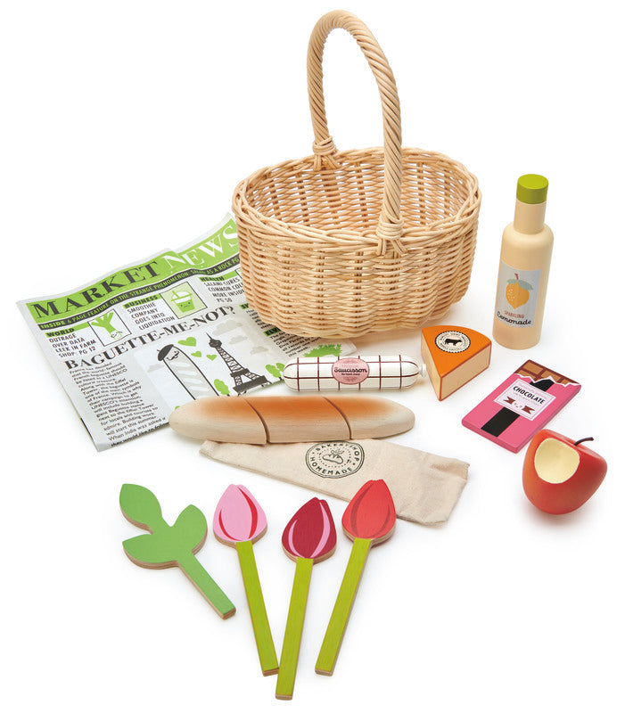 Child's wicker shopping basket with wooden  apple, flowers, cheese, salami, chocolate, lemonade and bread - Tender Leaf Toys at Send A Toy