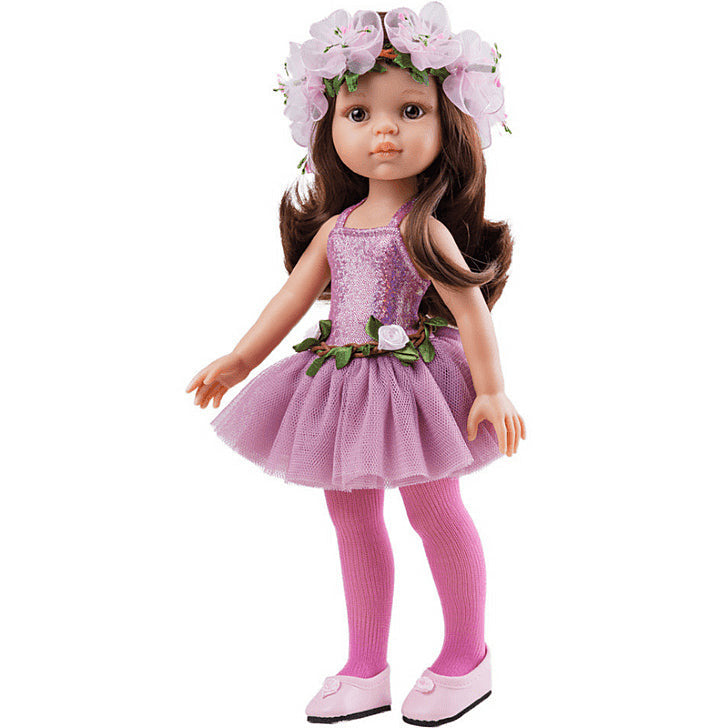 A vinyl doll depicting a ballerina in a purple tutu with a floral headband, pink tights, and pink ballet shoes.
