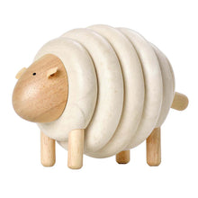 Wooden lacing toy shaped like a sheep, with beige and natural wood colors and lacing holes along its body.