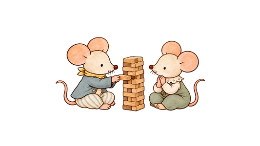 Send A Toy mouse mascots sitting down playing a wooden block game