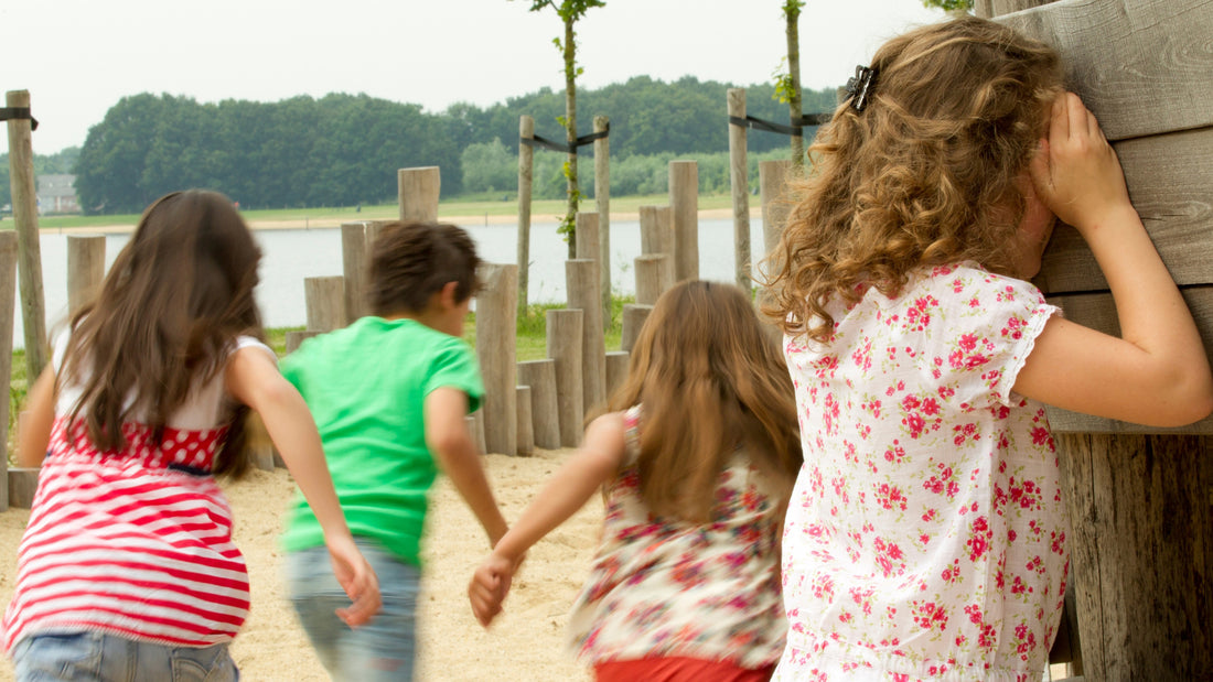 Children playing hide and seek game outside