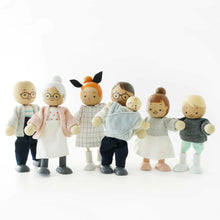 Set of wooden toy figures dressed in casual clothing on a white background
