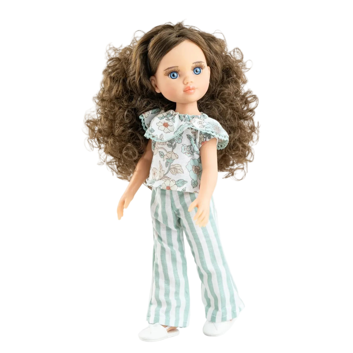 Doll with long brown hair wearing a patterned top and striped pants on a white background