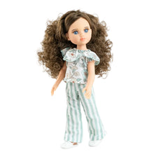 Doll with long brown hair wearing a patterned top and striped pants on a white background